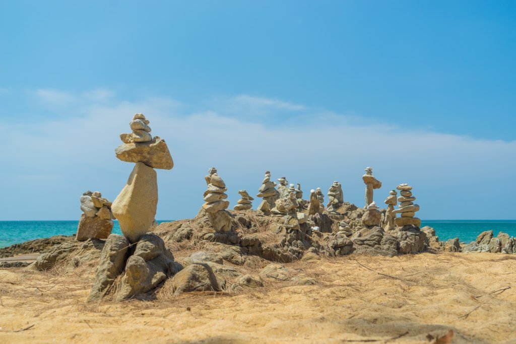 stacks of round stones on the beach 2023 11 27 04 53 10 utc